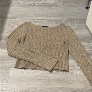Cropped light sweater